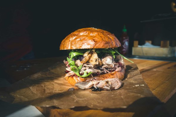 What techniques ensure a perfectly succulent duck confit with crispy skin?